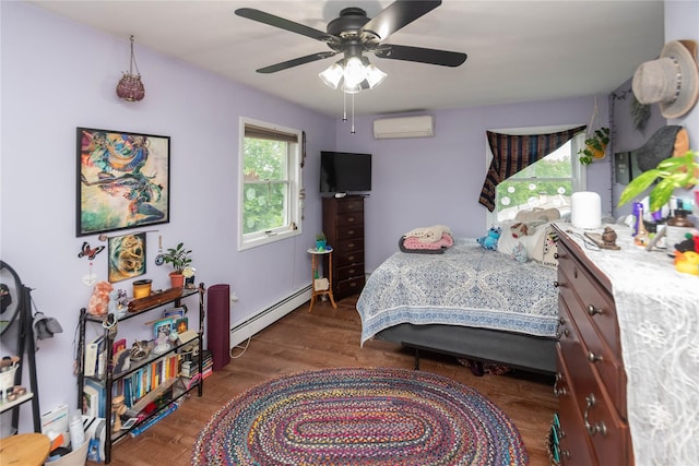 57 Decker Dr, Washingtonville, NY 10992 - bedroom with a baseboard radiator, a wall unit AC, wood finished floors, and a ceiling fan