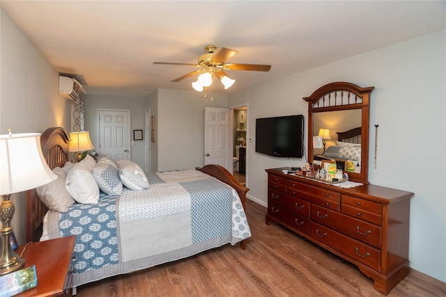 57 Decker Dr, Washingtonville, NY 10992 - bedroom featuring wood finished floors, ceiling fan, and an AC wall unit