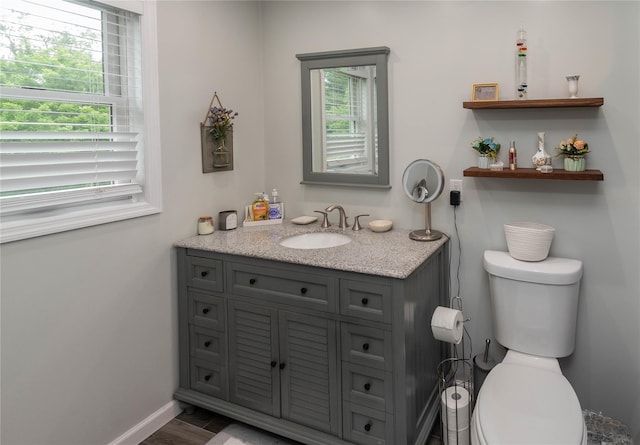 57 Decker Dr, Washingtonville, NY 10992 - bathroom with vanity, plenty of natural light, toilet, and baseboards