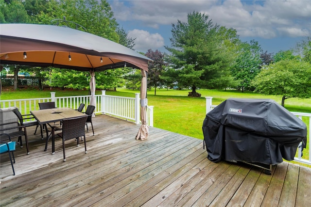 57 Decker Dr, Washingtonville, NY 10992 - deck featuring a gazebo, grilling area, outdoor dining space, a lawn, and view of wooded area