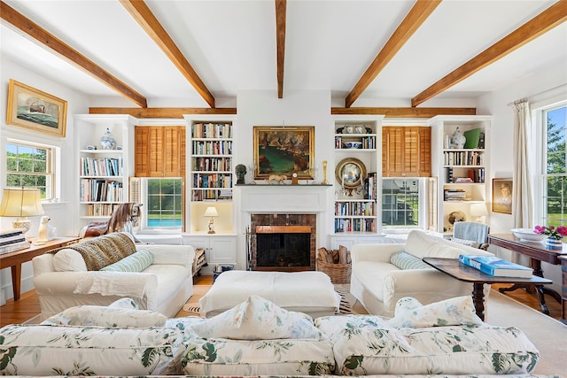 140AND144 Damascus Rd, East Quogue, NY 11942 - living area with a fireplace, beam ceiling, and wood finished floors