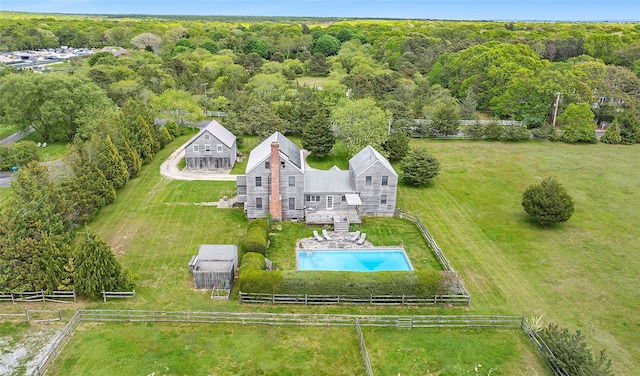 140AND144 Damascus Rd, East Quogue, NY 11942 - view of subject property with a pool and a heavily wooded area