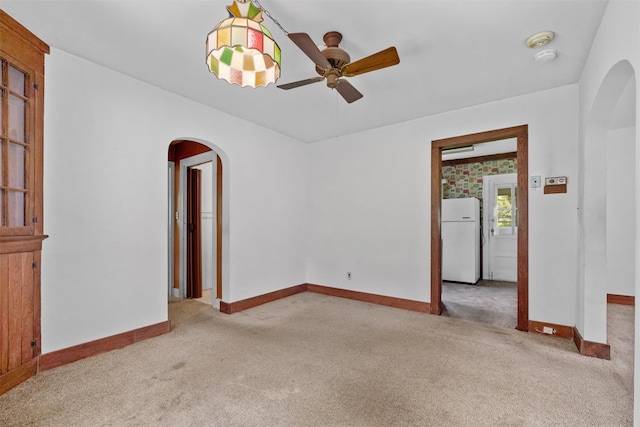 61 Spackenkill Rd, Poughkeepsie, NY 12603 - carpeted empty room featuring arched walkways, ceiling fan, and baseboards