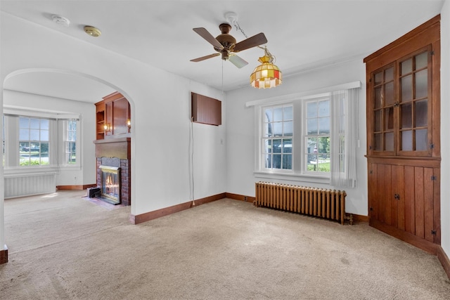 61 Spackenkill Rd, Poughkeepsie, NY 12603 - unfurnished room featuring radiator heating unit, radiator, carpet flooring, a ceiling fan, and baseboards