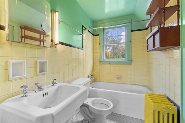 61 Spackenkill Rd, Poughkeepsie, NY 12603 - full bath with radiator heating unit, tile walls, tile patterned flooring, toilet, and a sink