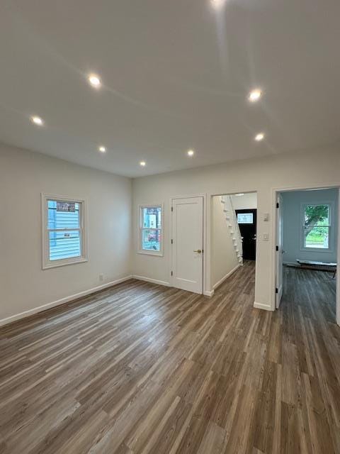 140 Ball St, Port Jervis, NY 12771 - unfurnished living room featuring healthy amount of natural light, dark wood-type flooring, baseboards, and recessed lighting