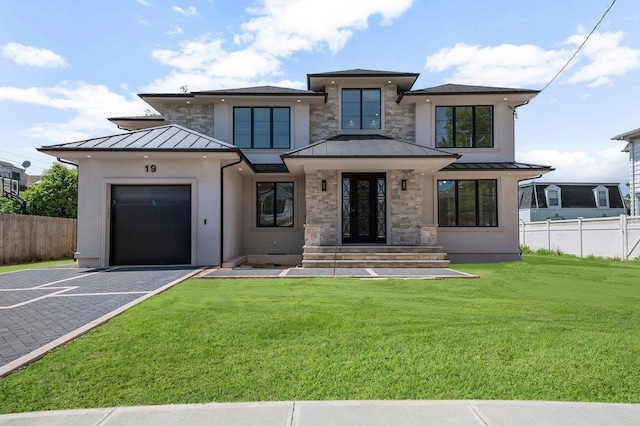 19 Maple Ave, Cedarhurst, NY 11516 - view of front of home with a standing seam roof, a garage, driveway, and metal roof