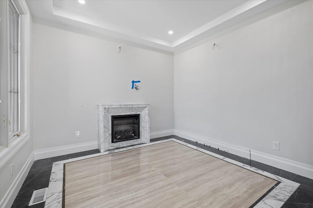19 Maple Ave, Cedarhurst, NY 11516 - unfurnished living room with inlaid floor details, marble finish flooring, recessed lighting, and a raised ceiling