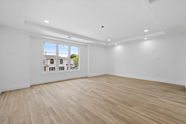 19 Maple Ave, Cedarhurst, NY 11516 - empty room with a raised ceiling, recessed lighting, baseboards, and light wood-style floors