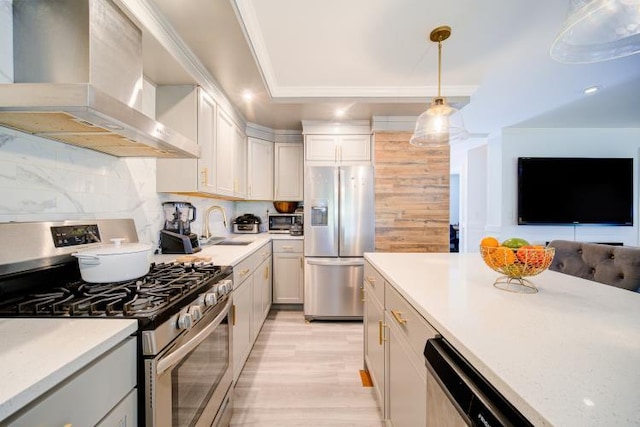 322 Noxon Rd, Poughkeepsie, NY 12603 - kitchen with appliances with stainless steel finishes, wall chimney exhaust hood, a sink, light countertops, and light wood finished floors