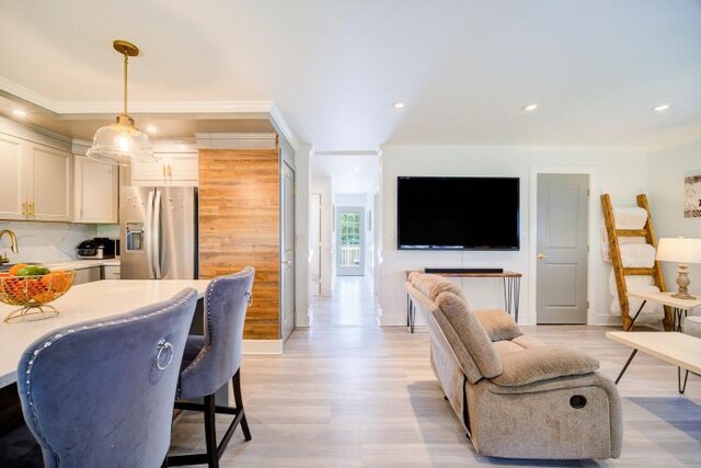 322 Noxon Rd, Poughkeepsie, NY 12603 - living room with light wood-type flooring, recessed lighting, and baseboards