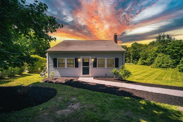 322 Noxon Rd, Poughkeepsie, NY 12603 - bungalow-style home with a chimney and a yard