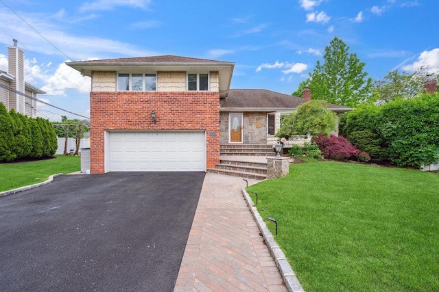 5 Coventry Rd, Syosset, NY 11791 - split level home featuring driveway, an attached garage, brick siding, and a front yard