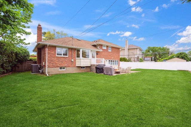 5 Coventry Rd, Syosset, NY 11791 - back of property with central AC unit, a chimney, and brick siding