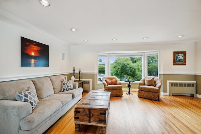 5 Coventry Rd, Syosset, NY 11791 - living area featuring radiator, light wood-style floors, recessed lighting, ornamental molding, and baseboards