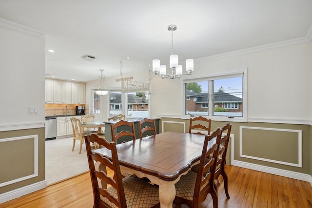 5 Coventry Rd, Syosset, NY 11791 - dining room featuring a chandelier, ornamental molding, light wood finished floors, a wainscoted wall, and recessed lighting