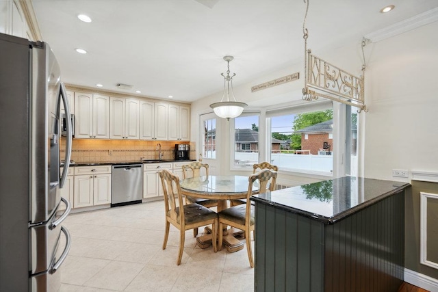 5 Coventry Rd, Syosset, NY 11791 - kitchen with stainless steel appliances, a sink, tasteful backsplash, hanging light fixtures, and light tile patterned flooring