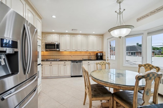 5 Coventry Rd, Syosset, NY 11791 - kitchen featuring appliances with stainless steel finishes, a sink, healthy amount of natural light, dark countertops, and recessed lighting