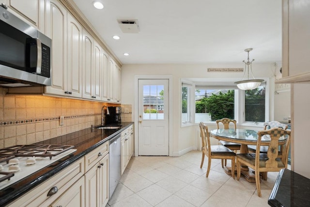 5 Coventry Rd, Syosset, NY 11791 - kitchen with appliances with stainless steel finishes, a sink, backsplash, pendant lighting, and recessed lighting