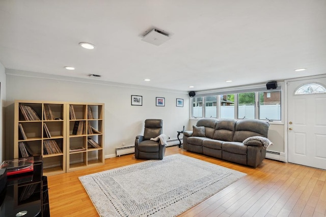 5 Coventry Rd, Syosset, NY 11791 - living area with baseboard heating, light wood-style floors, recessed lighting, and crown molding