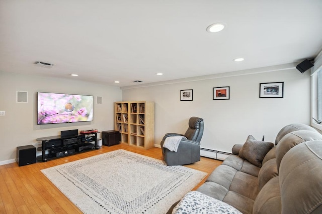 5 Coventry Rd, Syosset, NY 11791 - living room featuring a baseboard radiator, baseboards, light wood-style floors, and recessed lighting
