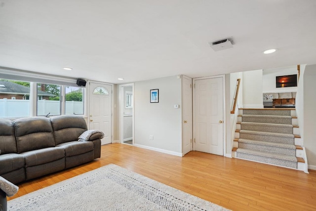 5 Coventry Rd, Syosset, NY 11791 - living room featuring wood finished floors, stairway, baseboards, and recessed lighting