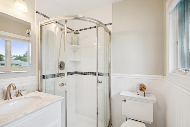 5 Coventry Rd, Syosset, NY 11791 - full bath featuring vanity, toilet, a stall shower, and wainscoting