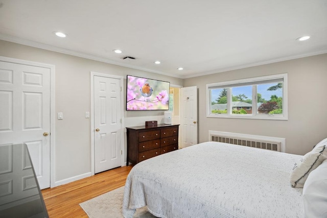 5 Coventry Rd, Syosset, NY 11791 - bedroom with radiator heating unit, light wood-style flooring, recessed lighting, ornamental molding, and baseboards