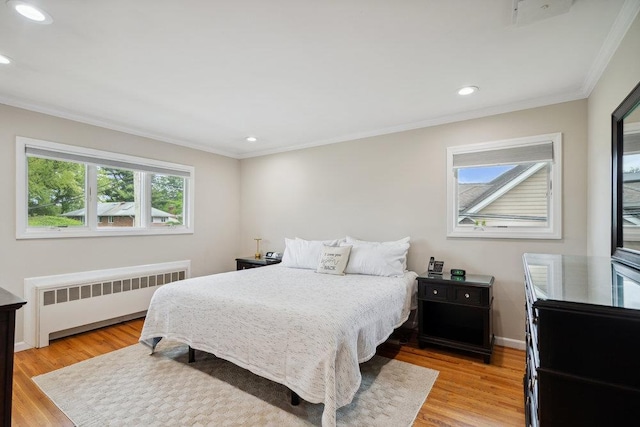 5 Coventry Rd, Syosset, NY 11791 - bedroom featuring radiator, crown molding, light wood finished floors, and recessed lighting
