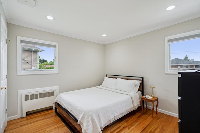 5 Coventry Rd, Syosset, NY 11791 - bedroom featuring radiator, light wood-style floors, crown molding, baseboards, and recessed lighting