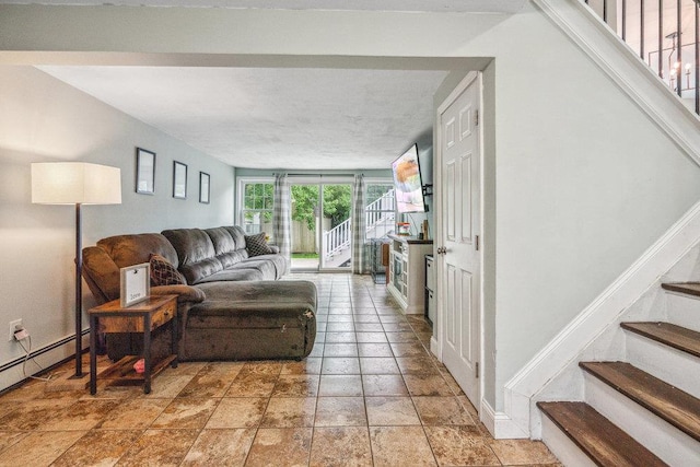 12 Pleasant Pl, Farmingville, NY 11738 - living area with stairs, baseboard heating, light stone finish flooring, and baseboards