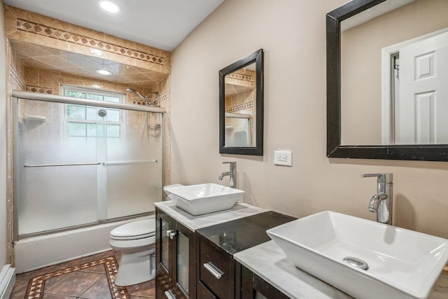 12 Pleasant Pl, Farmingville, NY 11738 - bathroom with toilet, bath / shower combo with glass door, double vanity, recessed lighting, and tile patterned flooring