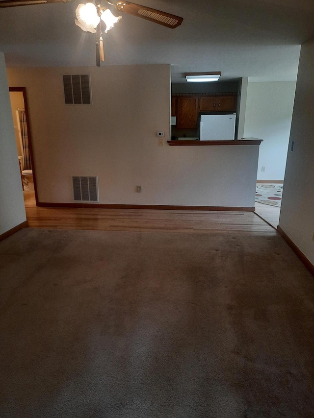 1502 Evergreen Ct, Highland Mills, NY 10930 - unfurnished living room featuring ceiling fan, baseboards, and light colored carpet