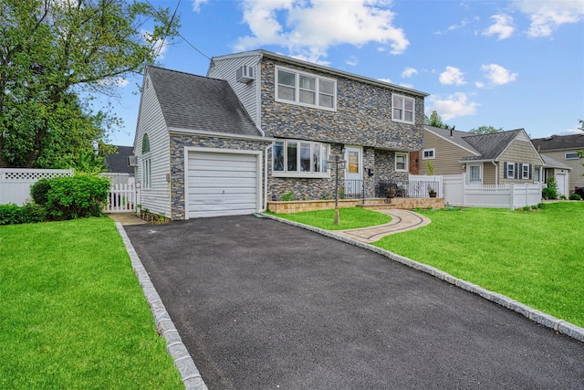 21 Westgate Rd, Massapequa Park, NY 11762 - view of front of property featuring stone siding, an attached garage, and asphalt driveway