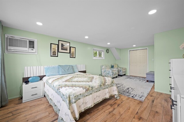 21 Westgate Rd, Massapequa Park, NY 11762 - bedroom featuring light wood finished floors, a wall mounted air conditioner, recessed lighting, and a closet