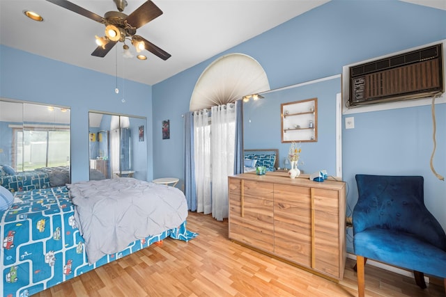 21 Westgate Rd, Massapequa Park, NY 11762 - bedroom featuring an AC wall unit, wood finished floors, multiple windows, ceiling fan, and recessed lighting