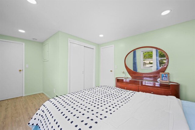 21 Westgate Rd, Massapequa Park, NY 11762 - bedroom with wood finished floors, recessed lighting, a closet, and baseboards