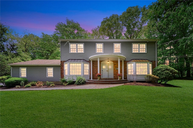 47 Woodland Dr, Oyster Bay Cove, NY 11771 - view of front of home featuring a front lawn