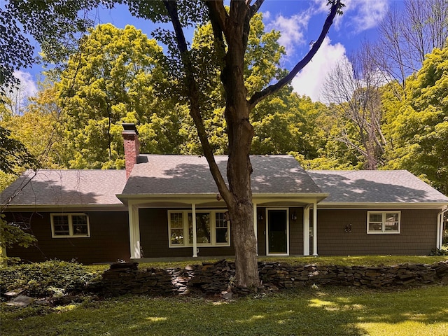287 Hunns Lake Rd, Stanfordville, NY 12581 - ranch-style house with a chimney, a front yard, and a shingled roof
