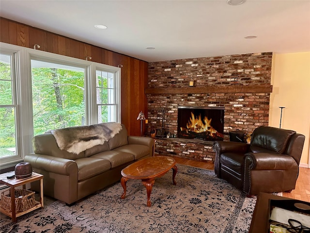 287 Hunns Lake Rd, Stanfordville, NY 12581 - living room with plenty of natural light, wood finished floors, a brick fireplace, and wooden walls