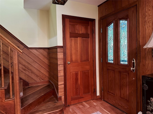 287 Hunns Lake Rd, Stanfordville, NY 12581 - entryway with wainscoting, wood walls, and light wood-type flooring