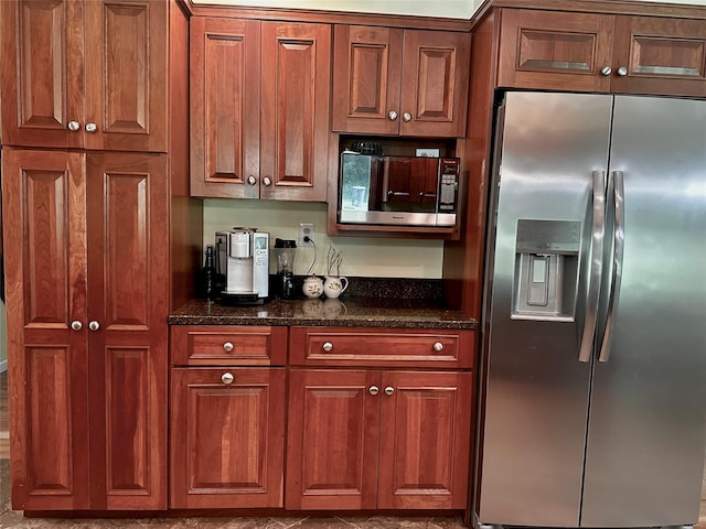 287 Hunns Lake Rd, Stanfordville, NY 12581 - kitchen with appliances with stainless steel finishes, dark stone countertops, and brown cabinets
