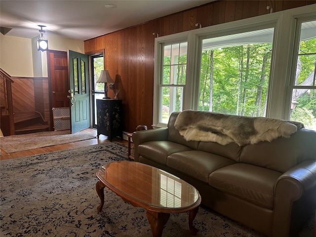 287 Hunns Lake Rd, Stanfordville, NY 12581 - living area featuring wood walls, healthy amount of natural light, wood finished floors, baseboard heating, and stairway