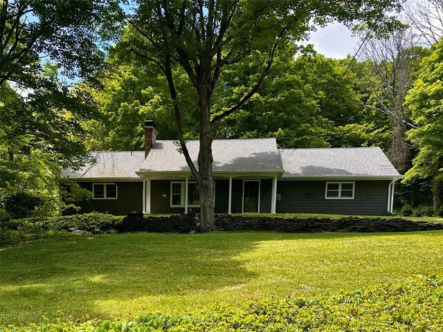 287 Hunns Lake Rd, Stanfordville, NY 12581 - ranch-style house featuring a chimney, a front yard, and a shingled roof
