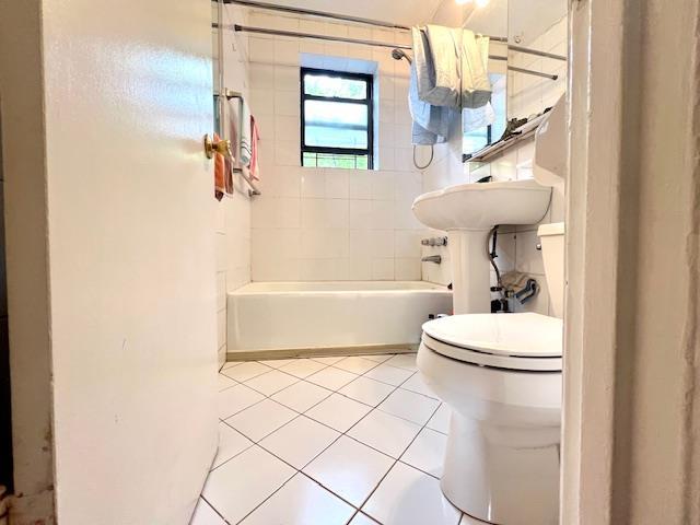 215-19 48th Ave Unit 3C, Bayside, NY 11364 - full bathroom featuring tile patterned flooring,  shower combination, and toilet