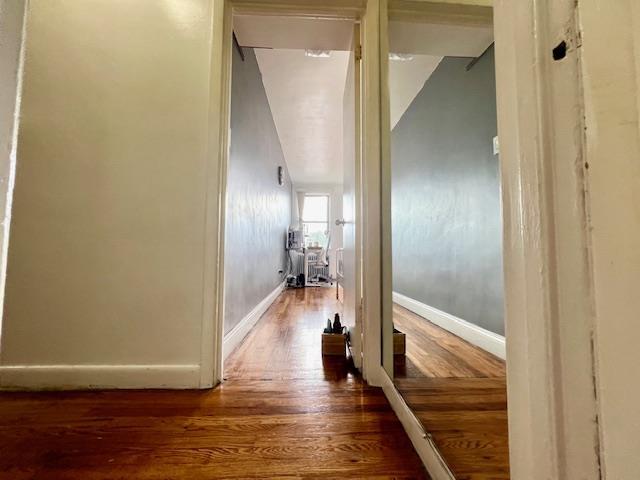 215-19 48th Ave Unit 3C, Bayside, NY 11364 - hallway featuring wood finished floors and baseboards