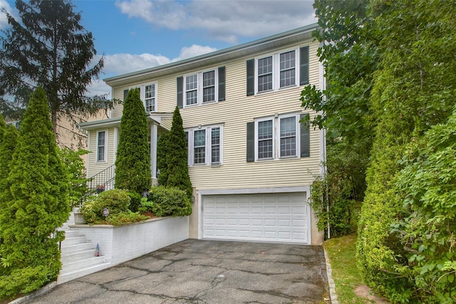 36 Bellefair Rd, Rye Brook, NY 10573 - colonial house with a garage, asphalt driveway, and stairway