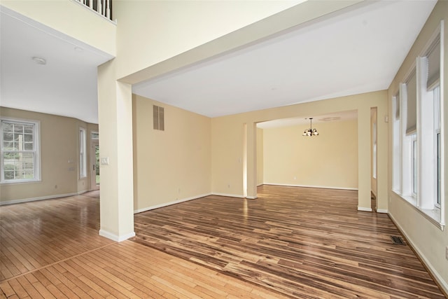 36 Bellefair Rd, Rye Brook, NY 10573 - spare room featuring a chandelier and hardwood / wood-style flooring