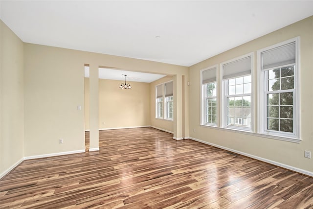 36 Bellefair Rd, Rye Brook, NY 10573 - spare room with wood finished floors and a chandelier