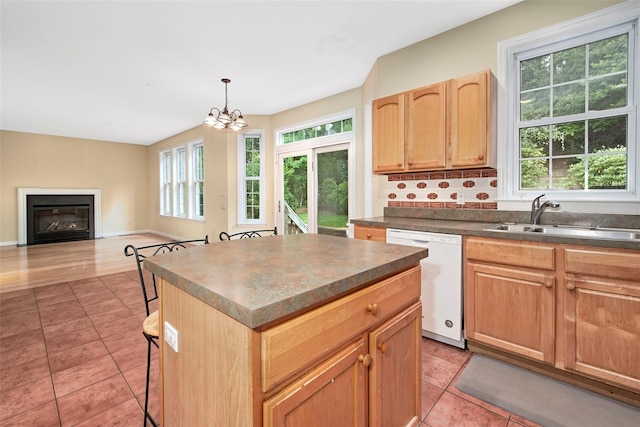 36 Bellefair Rd, Rye Brook, NY 10573 - kitchen with plenty of natural light, white dishwasher, light brown cabinetry, and light tile patterned floors